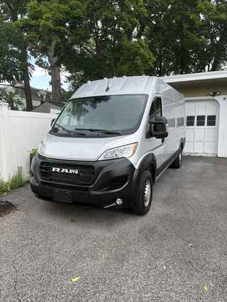 KGY Logistics Unit KGY-01 — 2026 Ram ProMaster 3500, front three-quarter view, silver
